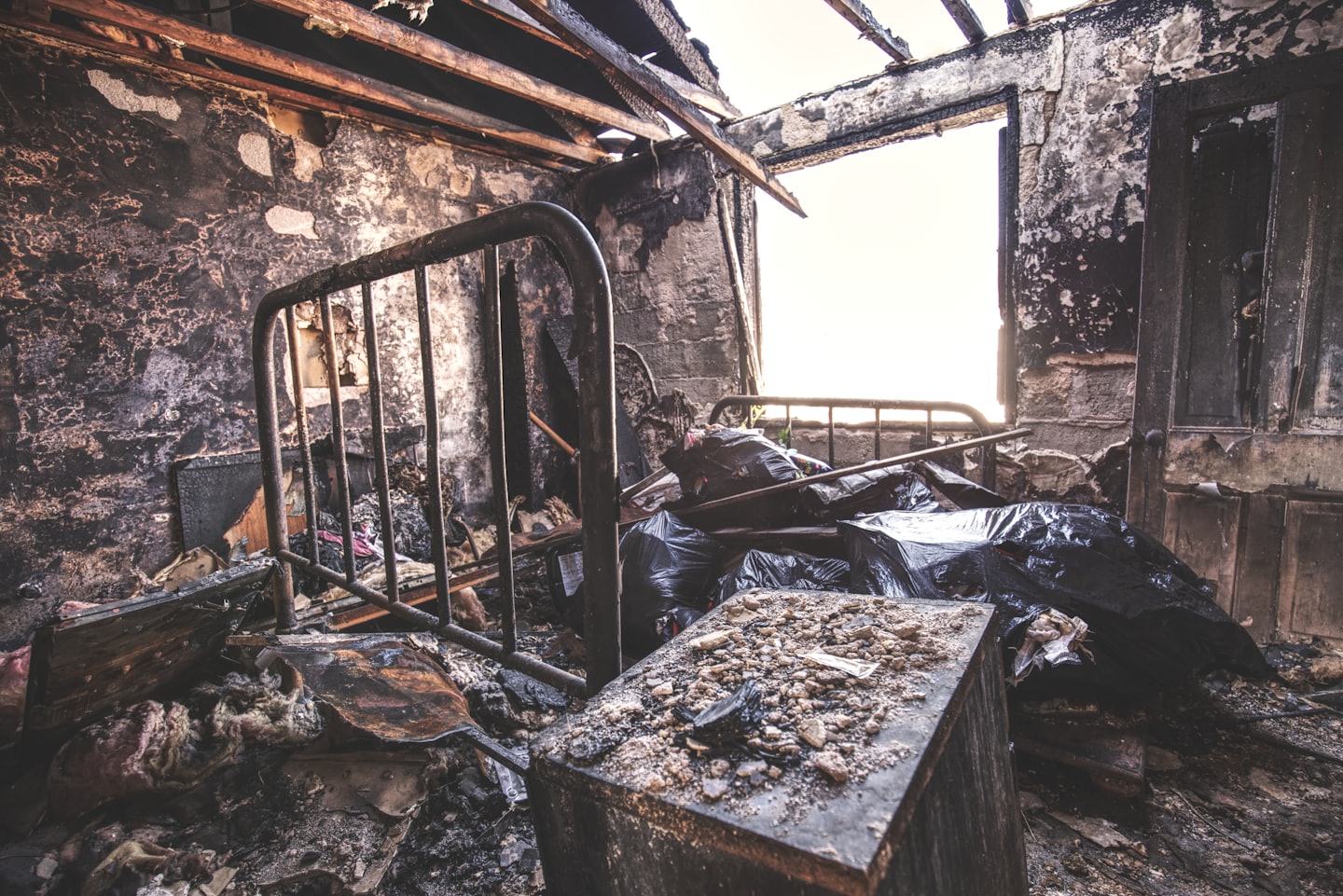 Charred remains of a bedroom after a house fire.